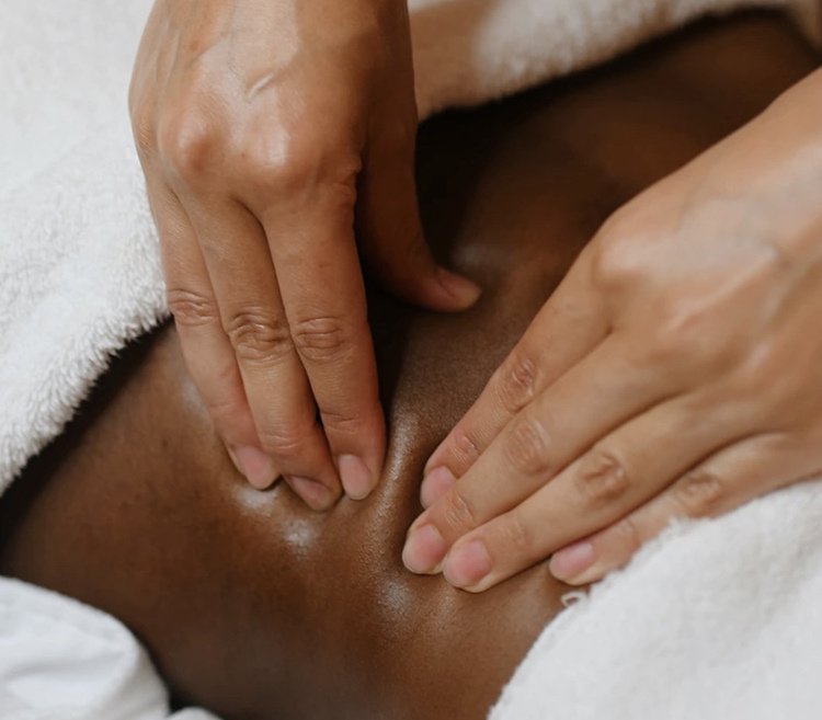 Close detail of hands applying pressure during a massage