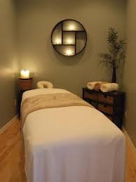 Massage table prepared in a softly lit treatment room